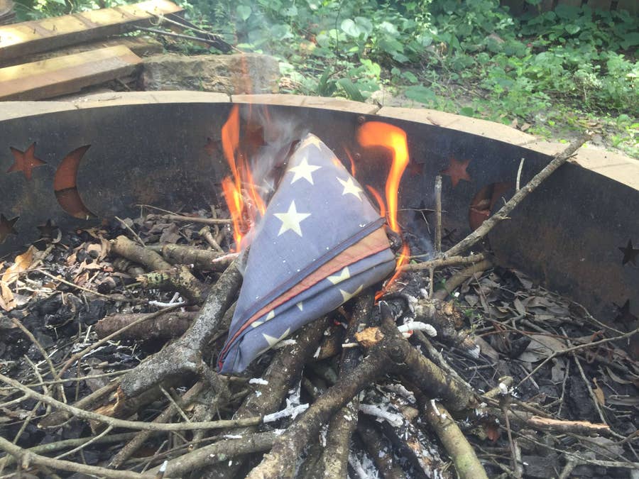 Carefully place and burn the flag